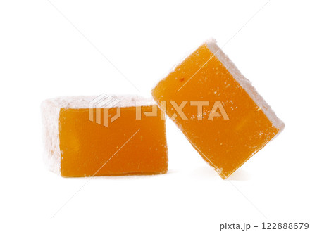Colorful Turkish delight squares with a soft texture on a white background, showcasing a traditional sweet treat 122888679