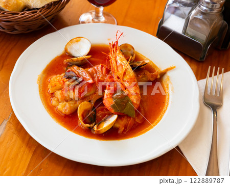 Tail of monkfish with shellfish, prawns Tail of monkfish with shellfish, prawns 122889787
