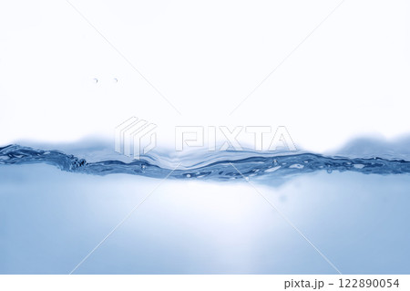 Closeup view of dynamic flowing blue water waves on white background. Liquid splash. Texture and abstract background Closeup view of dynamic flowing blue water waves on white background. Liquid splash. Texture and abstract background 122890054