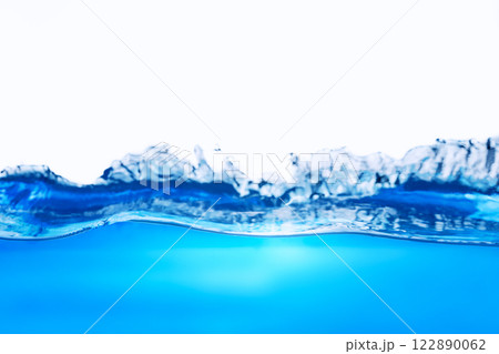 Closeup view of dynamic flowing blue water waves on white background. Liquid splash. Texture and abstract background 122890062