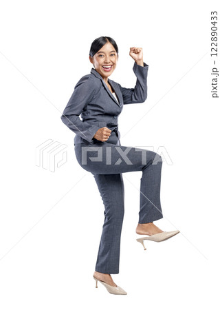 Portrait of an Asian businesswoman raising hands with an excited expression isolated over a white background. Concept of business, entrepreneur, and successful Portrait of an Asian businesswoman raising hands with an excited expression isolated over a white background. Concept of business, entrepreneur, and successful 122890433