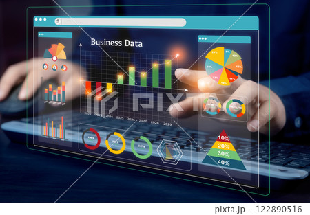 A businessman investor analyzes the profitability of working companies with digital augmented reality graphics and positive indicators. business planning and stock investment growth concept. A businessman investor analyzes the profitability of working companies with digital augmented reality graphics and positive indicators. business planning and stock investment growth concept. 122890516