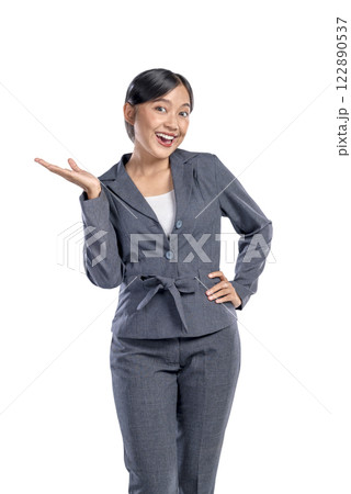 Portrait of an Asian businesswoman standing with open palm hand gesture isolated over a white background. Copy space. Concept of business, entrepreneur, and successful Portrait of an Asian businesswoman standing with open palm hand gesture isolated over a white background. Copy space. Concept of business, entrepreneur, and successful 122890537