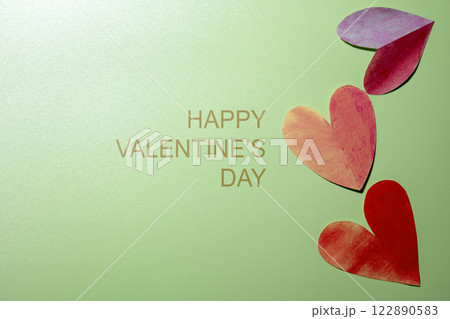 Red hearts with text of Happy Valentine Day on a colored background Red hearts with text of Happy Valentine Day on a colored background 122890583
