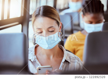Covid, travel and woman with mask on bus with phone with, social media, communication or networking on transport. Girl, digital or mobile app for safety compliance, health or 5g network or smartphone Covid, travel and woman with mask on bus with phone with, social media, communication or networking on transport. Girl, digital or mobile app for safety compliance, health or 5g network or smartphone 122892320