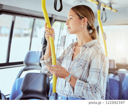Woman travel with smartphone on bus transportation check social media, website or internet for information about the city. Young person with 5g cellphone on public transport in urban town lens flare Woman travel with smartphone on bus transportation check social media, website or internet for information about the city. Young person with 5g cellphone on public transport in urban town lens flare 122892397