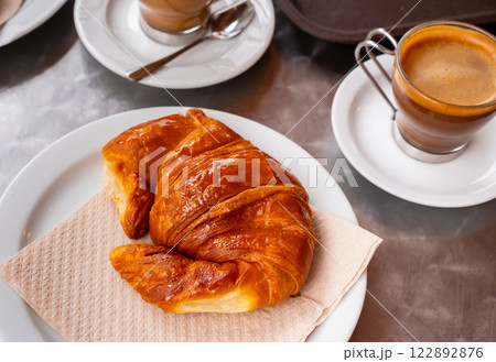Croissant served for breakfast with cup of coffee 122892876