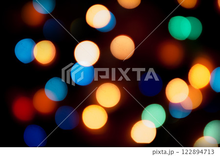 Color bokeh with defocused garland.Christmas lights defocused background 122894713