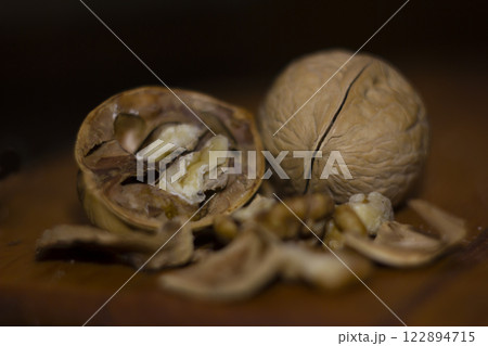 walnuts with shells on a wooden table 122894715