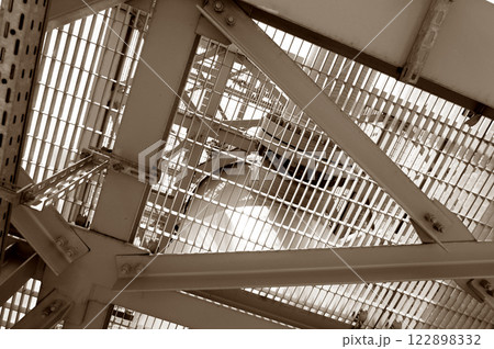 Close-up view of a durable industrial metal grid structure showcasing functional engineering design 122898332