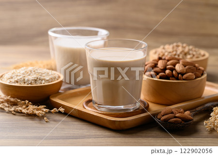 Alternative milk made from plant on wooden background, non dairy, Vegan food Alternative milk made from plant on wooden background, non dairy, Vegan food 122902056
