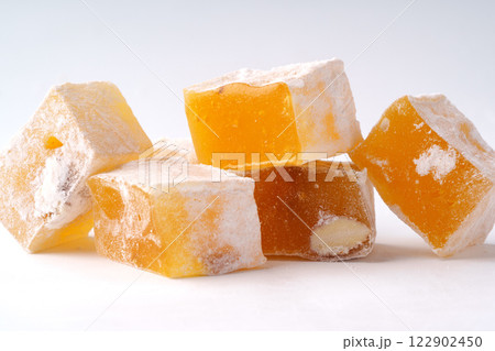 Colorful Turkish delight pieces arranged attractively on a plain background Colorful Turkish delight pieces arranged attractively on a plain background 122902450