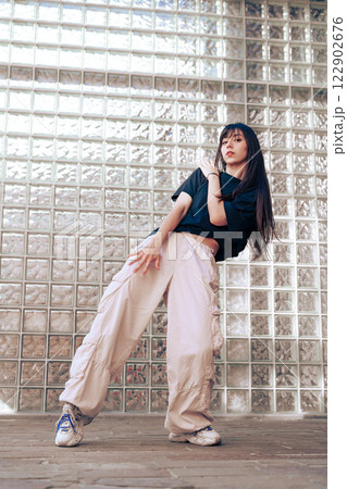 Dance performance with expressive movements in urban space highlighting skill and style at an indoor location 122902676