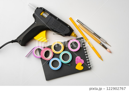 Creative crafting tools arranged on a workspace for art projects and decorations 122902767