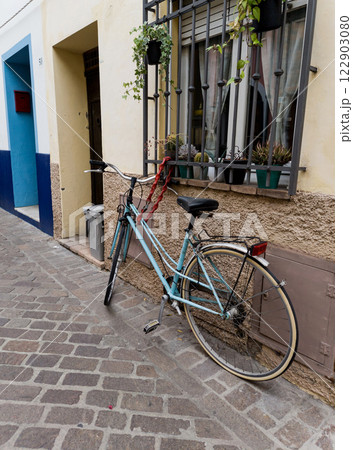 Vintage bicycle near old house Vintage bicycle near old house 122903080