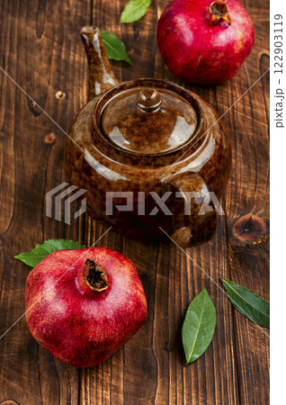 Hot fruit pomegranate tea in teapot. Hot fruit pomegranate tea in teapot. 122903119