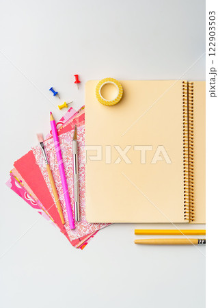 Colorful stationery and tools arranged on a clean workspace for creative planning and organization Colorful stationery and tools arranged on a clean workspace for creative planning and organization 122903503