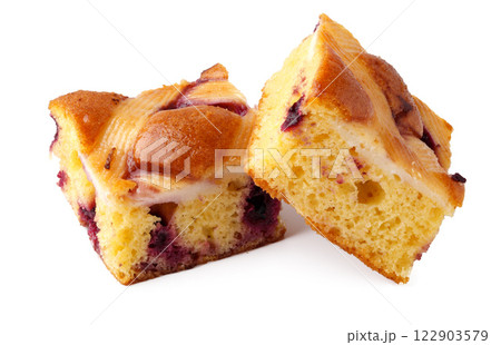 Homemade berry cake squares displayed on a white background with a light texture and rich glaze 122903579