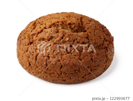 Freshly baked round ginger cookie displayed against a simple background 122903677