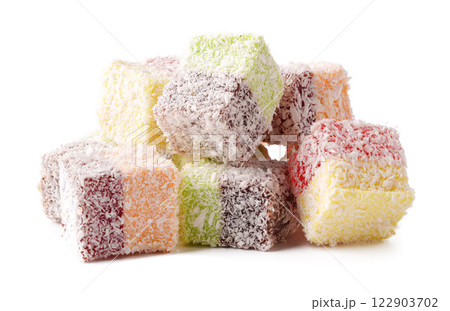 Colorful coconut coated sweets arranged in a delicious display ready to be enjoyed with tea or coffee Colorful coconut coated sweets arranged in a delicious display ready to be enjoyed with tea or coffee 122903702