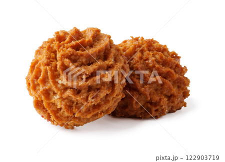 Baked coconut macaroons placed on a clean white surface ready for serving Baked coconut macaroons placed on a clean white surface ready for serving 122903719