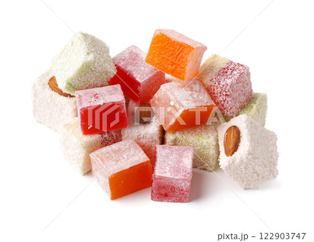 Colorful assortment of Turkish delight with nuts and powdered sugar arranged on a white background Colorful assortment of Turkish delight with nuts and powdered sugar arranged on a white background 122903747