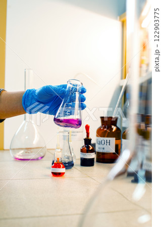 Laboratory experiment involving colorful chemical reactions in a research setting during a daytime session Laboratory experiment involving colorful chemical reactions in a research setting during a daytime session 122903775