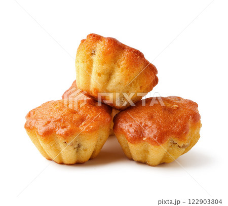 Delicious mini muffins stacked on a white background ready to be enjoyed at any time of day Delicious mini muffins stacked on a white background ready to be enjoyed at any time of day 122903804