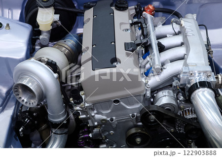 Close-up industrial engine and turbo charger that installed on car for tuned up power top speed and modify high performance Close-up industrial engine and turbo charger that installed on car for tuned up power top speed and modify high performance 122903888