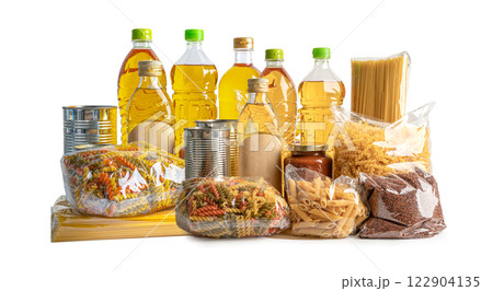 Foodstuff for donation, storage and delivery. Various food, pasta, cooking oil and canned food in cardboard box. 122904135