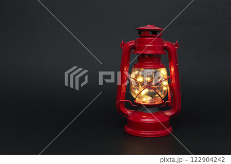 Glowed old lantern on black Glowed old lantern on black 122904242