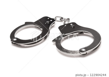 Handcuffs isolated on a white Handcuffs isolated on a white 122904244