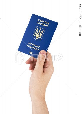 Passport of Ukraine in hand isolated on white Passport of Ukraine in hand isolated on white 122904253
