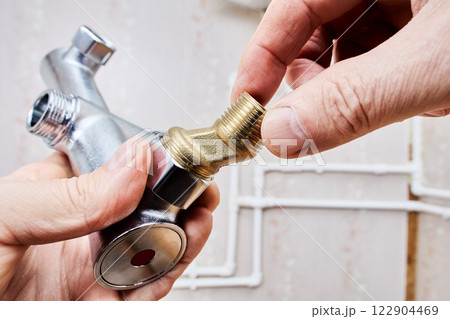 Threaded brass eccentric dog leg type reducer attaches to bathtub shower faucet. Threaded brass eccentric dog leg type reducer attaches to bathtub shower faucet. 122904469