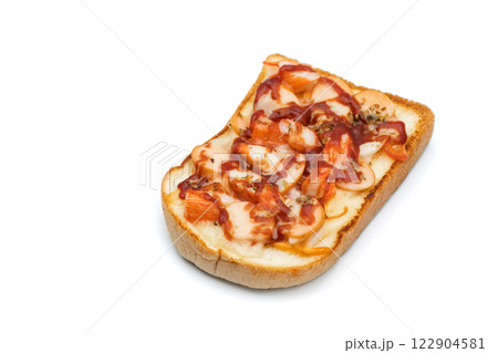 Homemade pizza is simple to make in the kitchen; all you need is bread, pizza sauce, and sausage. It is a family activity that everyone can participate in. White Background and Clipping Path. 122904581