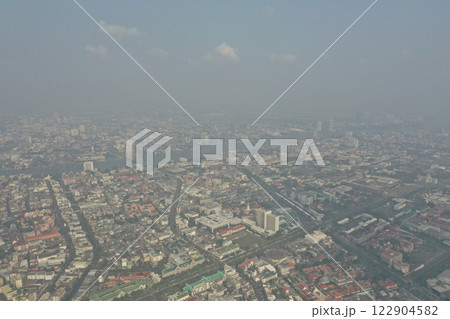 It is DUST in the Air in 2019, the Air Pollution of PM2.5 of the suburbs stretching to the big city. which was shrouded in dirty dust and the sky was wide with gigantic clouds. 122904582