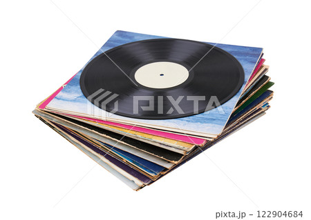 Vinyl record on a stack paper envelopes. Analog sound. Classic audio. Isolated on white Vinyl record on a stack paper envelopes. Analog sound. Classic audio. Isolated on white 122904684