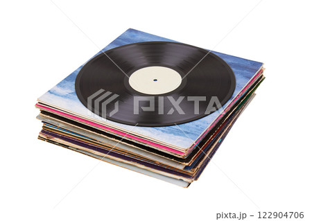 Vinyl record on a stack paper envelopes. Analog sound. Classic audio. Isolated on white Vinyl record on a stack paper envelopes. Analog sound. Classic audio. Isolated on white 122904706