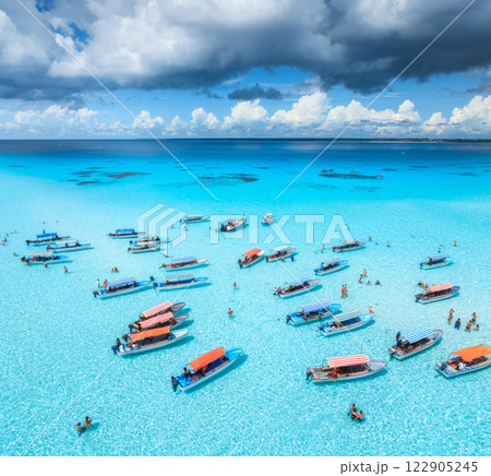 Aerial view of colorful boats, sandbank, blue sea on sunny day 122905245