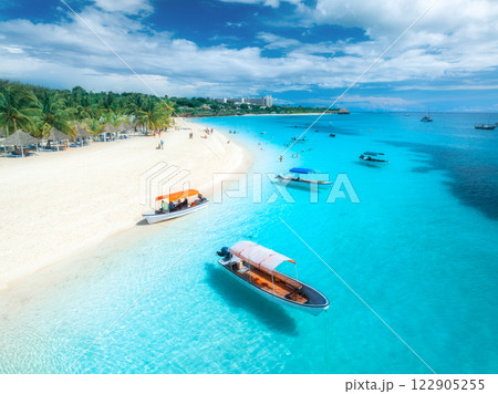 Aerial view of the boats and sea coast with white sandy beach Aerial view of the boats and sea coast with white sandy beach 122905255