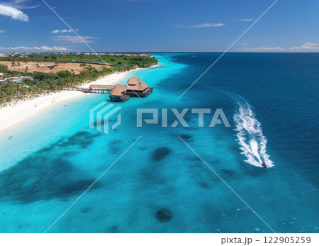 Aerial view of beautiful bungalow and sea at sunset in summer Aerial view of beautiful bungalow and sea at sunset in summer 122905259