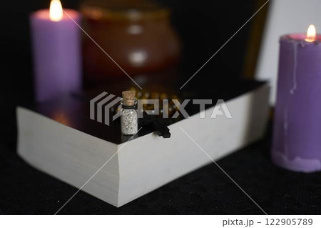 funeral, a photo frame, candles, urn for ashes, holy bible and spiritual bracelet with black cross , pendant with ashes funeral, a photo frame, candles, urn for ashes, holy bible and spiritual bracelet with black cross , pendant with ashes 122905789