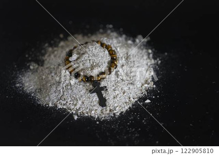 a spiritual bracelet with a cross in ashes, funeral 122905810