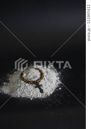 a spiritual bracelet with a cross in ashes, funeral 122905811
