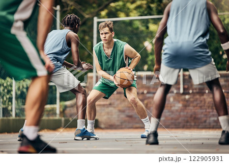 Basketball, team sport and competition for male athletes and players in training or professional match on an outdoor fitness court. Diversity, competitive and skill of men playing a ball game in USA Basketball, team sport and competition for male athletes and players in training or professional match on an outdoor fitness court. Diversity, competitive and skill of men playing a ball game in USA 122905931