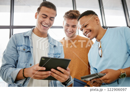 Technology, social media and tablet with friends happy laughing together looking at online content. Digital, web and internet video tech streaming of men with happiness watching a funny meme 122906097