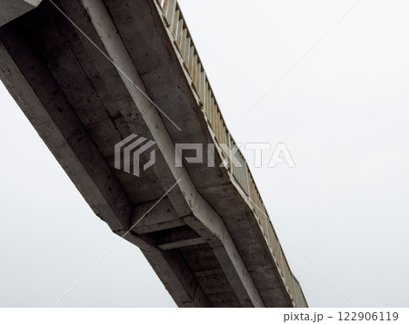 Photo of concrete pedestrian bridge with stairs underneath 122906119