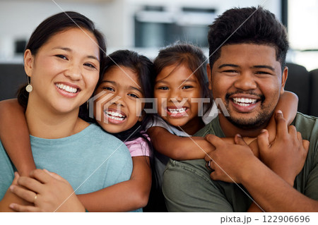 Family, smile and love of children for their mom and dad while sitting together in the lounge at home sharing a special bond. Portrait of happy Filipino man, woman and girl kids hugging their parents Family, smile and love of children for their mom and dad while sitting together in the lounge at home sharing a special bond. Portrait of happy Filipino man, woman and girl kids hugging their parents 122906696