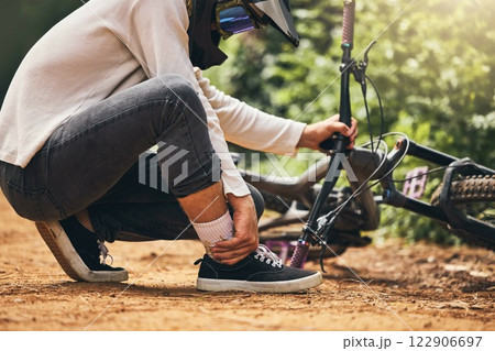 Sports bicycle and man with ankle injury on nature cycling trail in accident from bad decision. Cyclist athlete pain, inflammation and joint problem from dangerous wheel stunt movement. Sports bicycle and man with ankle injury on nature cycling trail in accident from bad decision. Cyclist athlete pain, inflammation and joint problem from dangerous wheel stunt movement. 122906697
