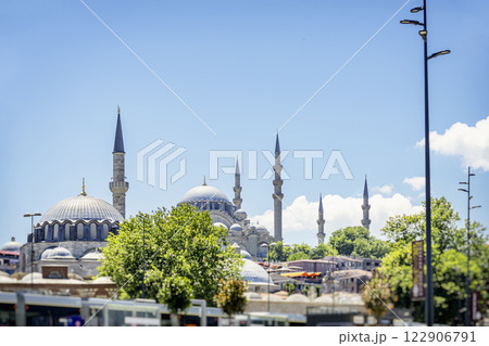 Blue Mosque. Scenic view of Istanbul's skyline with historic mosques and minarets. Greenery and modern city streets blend with Ottoman-era architecture. Vibrant urban atmosphere with cultural heritage Blue Mosque. Scenic view of Istanbul's skyline with historic mosques and minarets. Greenery and modern city streets blend with Ottoman-era architecture. Vibrant urban atmosphere with cultural heritage 122906791